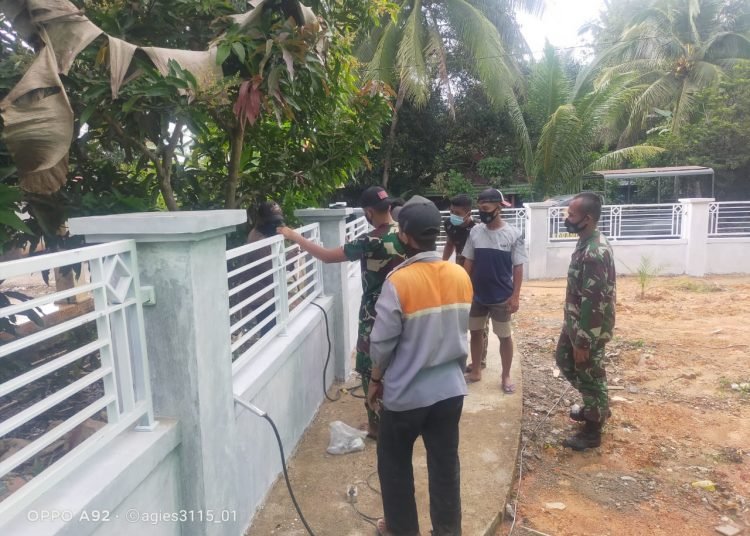 SATGAS TMMD PASANG PAGAR BESI MASJID NURUL HUDA